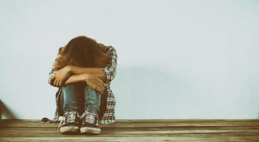 Sad woman hug her knee,nobody